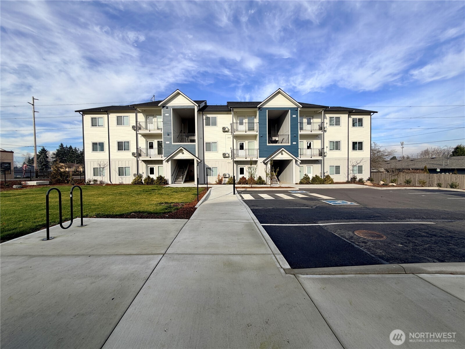 1202 East 72nd Street Tacoma, WA 98404 - Photo 5 of 25 a front view of a building with a garden