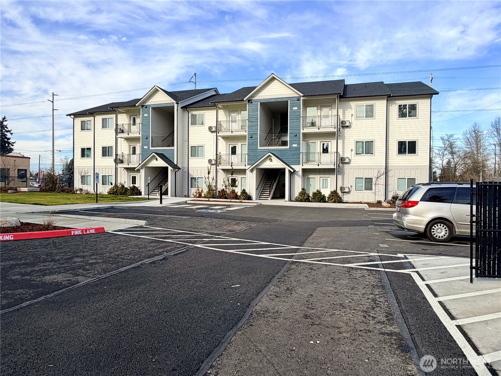 1202 East 72nd Street Tacoma, WA 98404 - Photo 6 of 25 a view of a street with cars parked