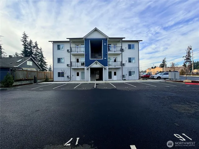 a front view of a house with a street
