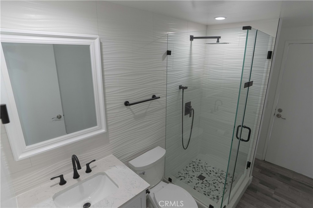 12230 Stewarton Drive Porter Ranch, CA 91326 - Photo 22 of 37 a bathroom with a sink toilet and shower