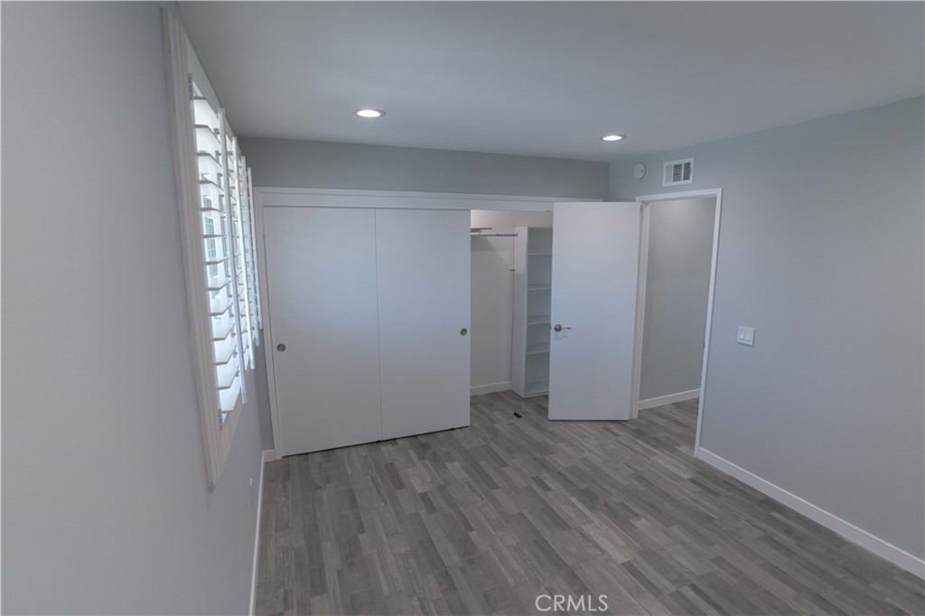 12230 Stewarton Drive Porter Ranch, CA 91326 - Photo 26 of 37 a view of hallway with wooden floor