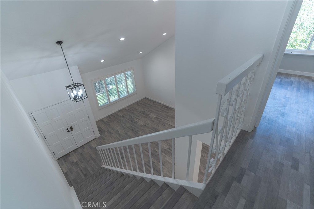 12230 Stewarton Drive Porter Ranch, CA 91326 - Photo 28 of 37 a view of entryway and hall with wooden floor
