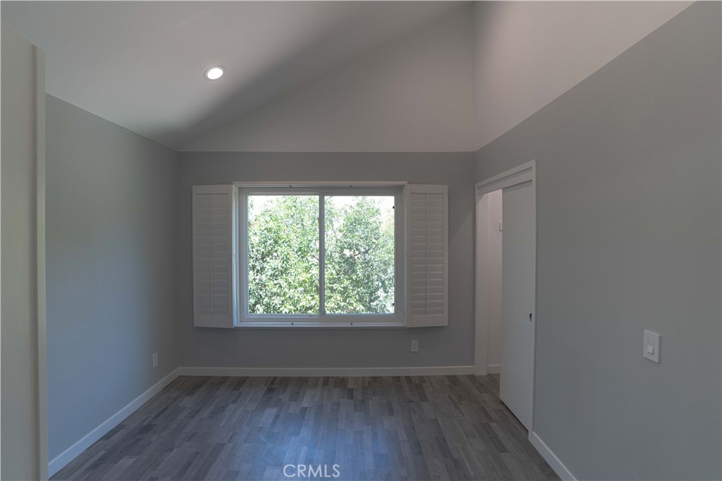 12230 Stewarton Drive Porter Ranch, CA 91326 - Photo 29 of 37 an empty room with wooden floor and windows