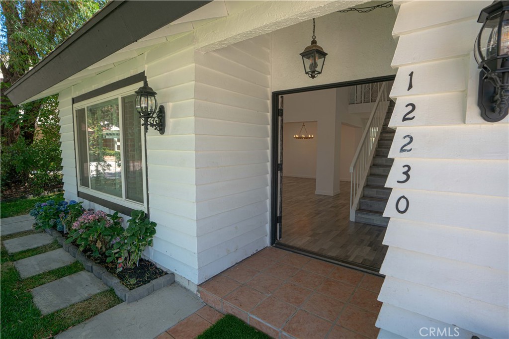 12230 Stewarton Drive Porter Ranch, CA 91326 - Photo 4 of 37 front view of a house with a yard