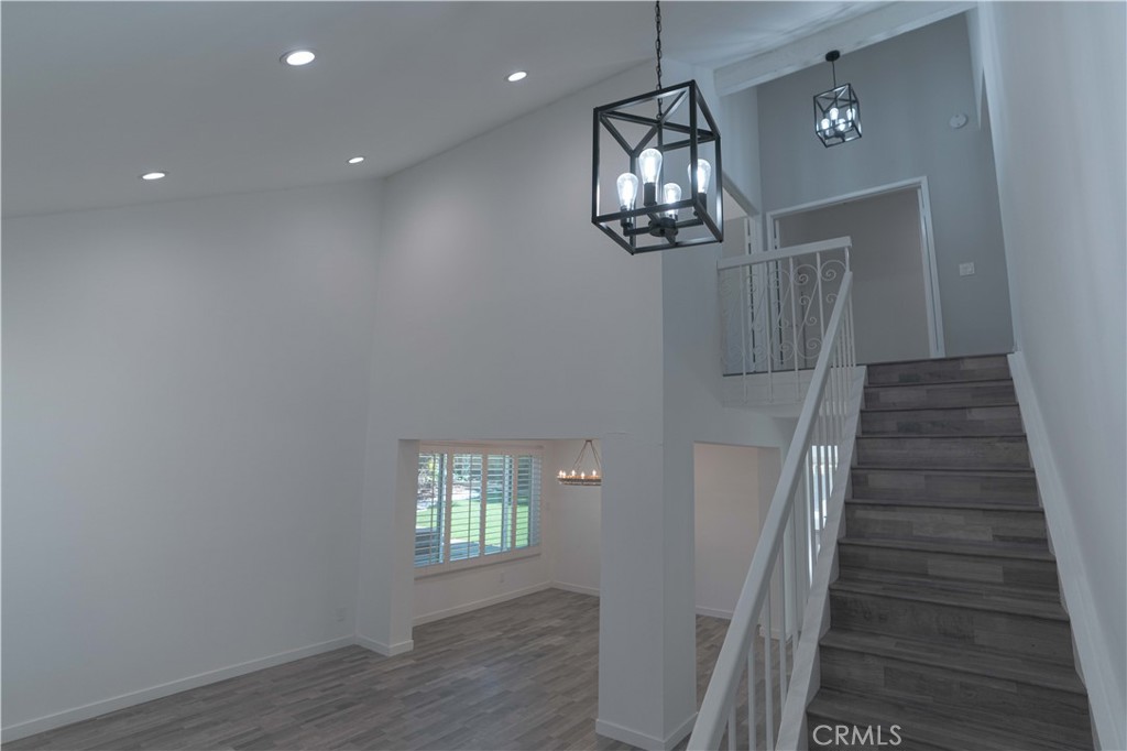 12230 Stewarton Drive Porter Ranch, CA 91326 - Photo 5 of 37 wooden floor in an empty room with a window