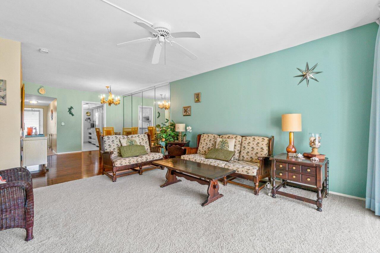 2460 Southwest 22nd Avenue, Unit 809 Delray Beach, FL 33445 - Photo 11 of 27 a living room with furniture
