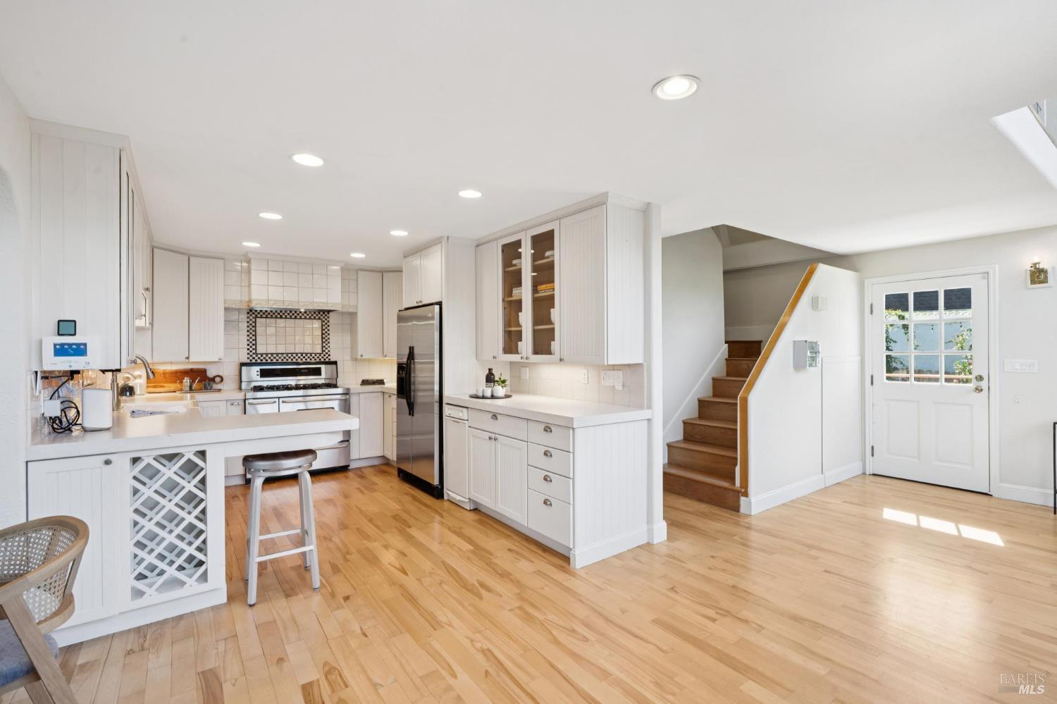 347 Jewell Street San Rafael, CA 94901 - Photo 39 of 61 a kitchen with white cabinets and stainless steel appliances