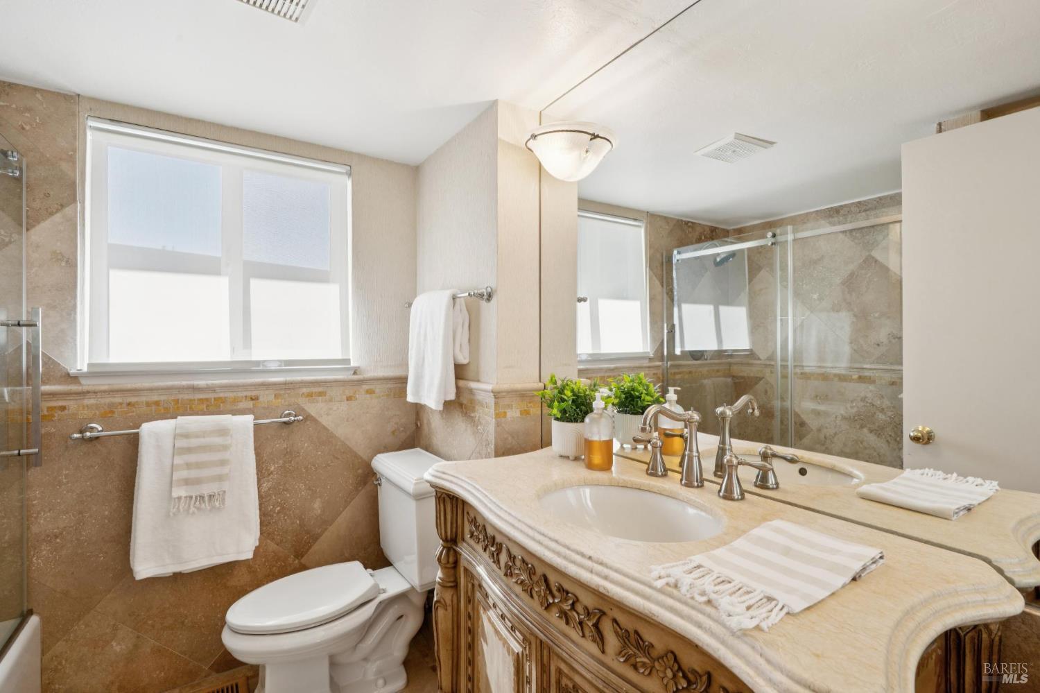 347 Jewell Street San Rafael, CA 94901 - Photo 57 of 61 a bathroom with a granite countertop sink a toilet and a large mirror