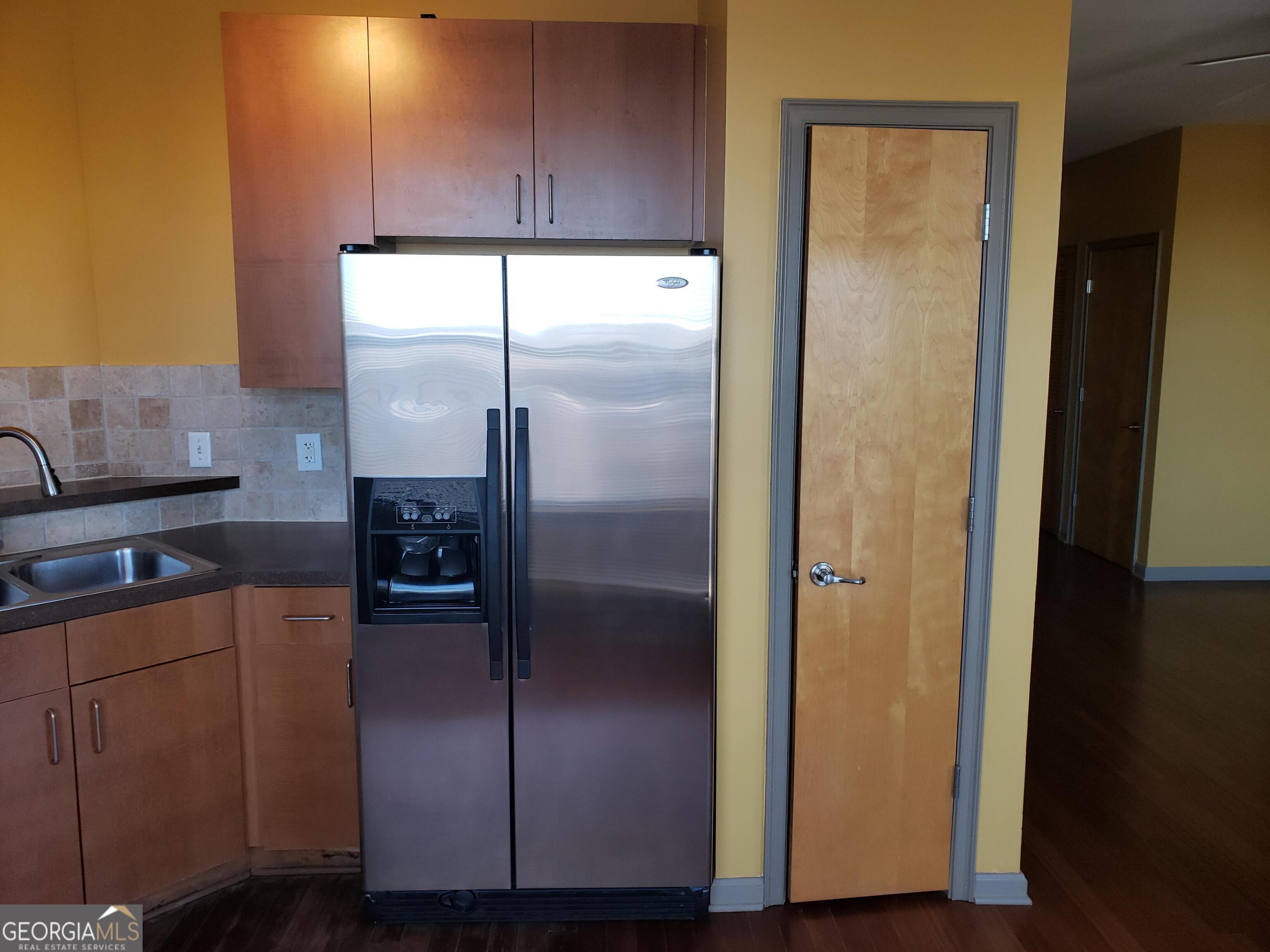 898 Oak Street Southwest, Unit 1303 Atlanta, GA 30310 - Photo 11 of 17 a kitchen with a refrigerator and a sink