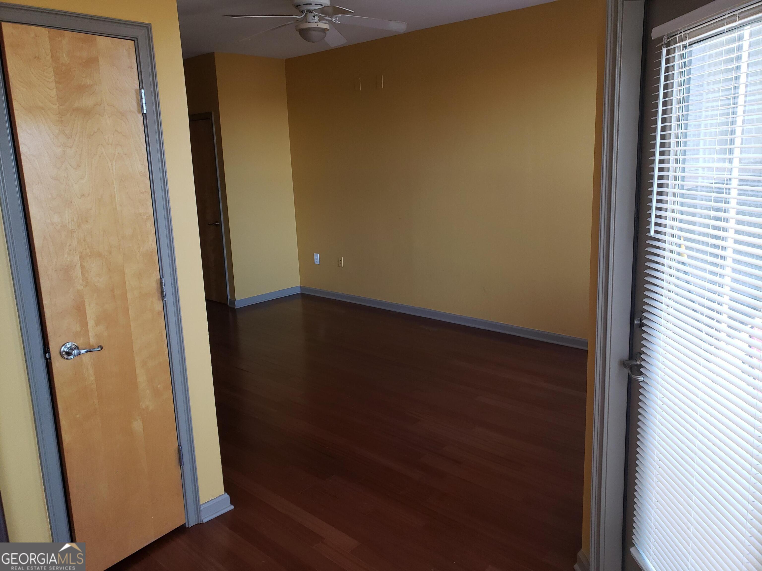 898 Oak Street Southwest, Unit 1303 Atlanta, GA 30310 - Photo 16 of 17 an empty room with wooden floor