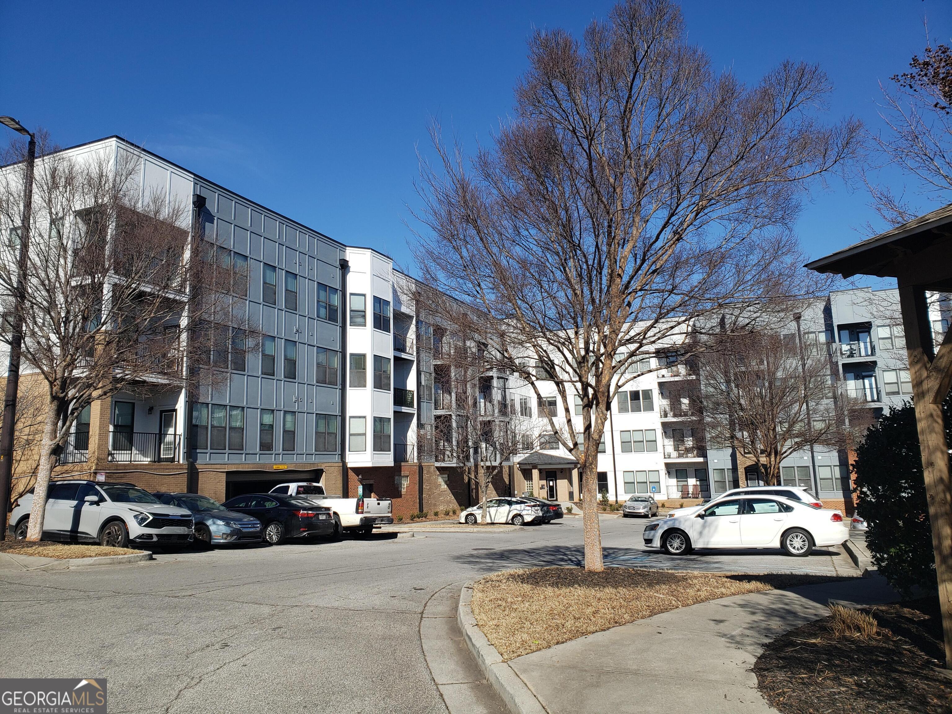 898 Oak Street Southwest, Unit 1303 Atlanta, GA 30310 - Photo 2 of 17 a view of a cars parked in front of a building