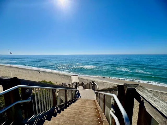 an aerial view of a house with garden space and street view