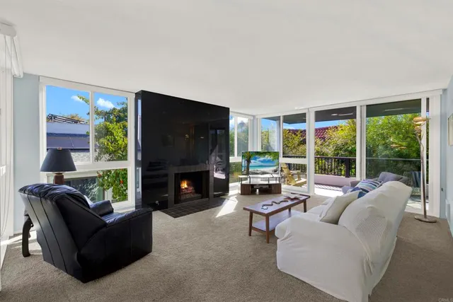 a view of a living room filled with furniture