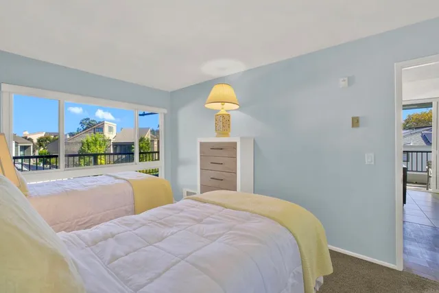 a en suite bathroom with a granite countertop sink and a mirror