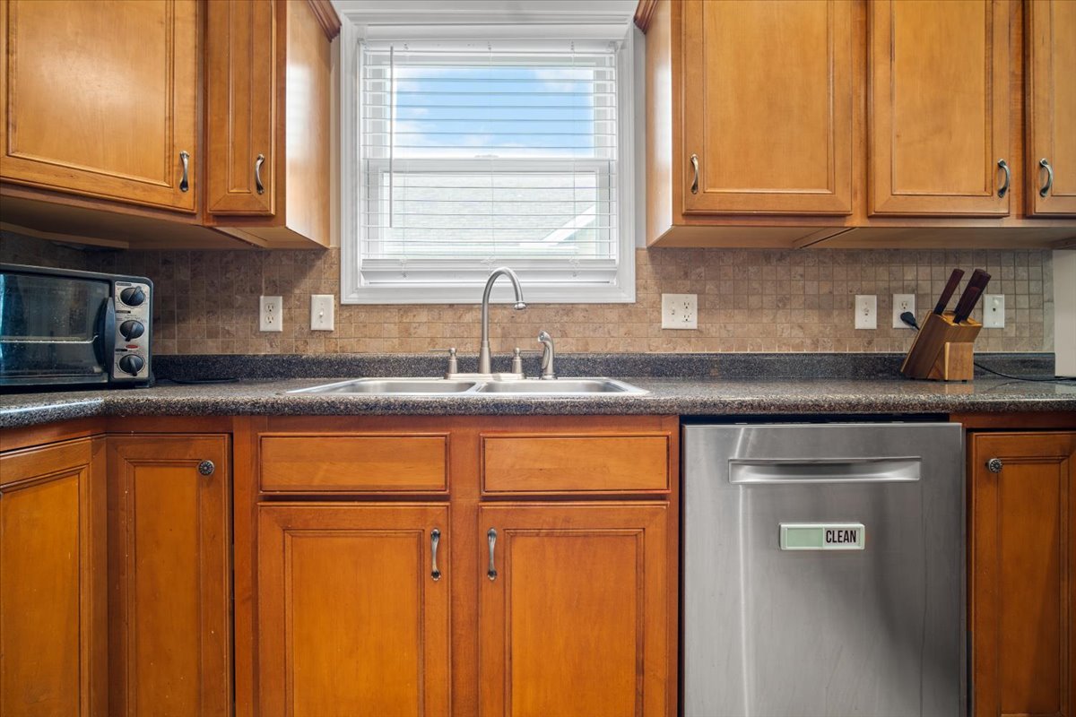 1600 Belclare Road Normal, IL 61761 - Photo 17 of 40 a kitchen with granite countertop cabinets stainless steel appliances and a sink
