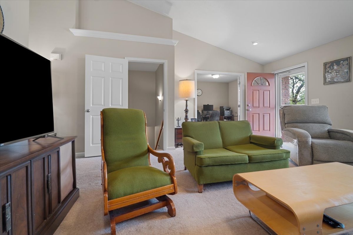 1600 Belclare Road Normal, IL 61761 - Photo 26 of 40 a living room with furniture and a flat screen tv