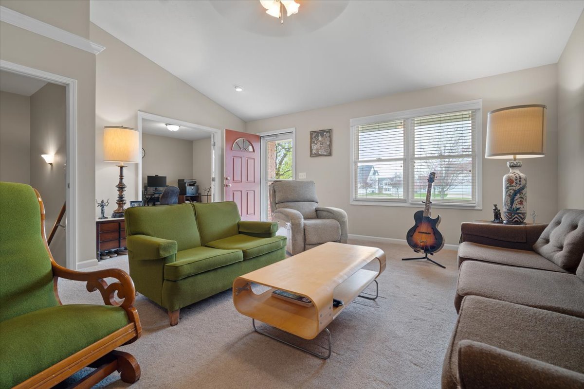 1600 Belclare Road Normal, IL 61761 - Photo 27 of 40 a living room with furniture and a large window