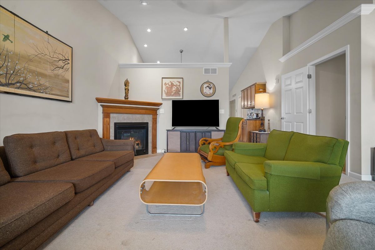 1600 Belclare Road Normal, IL 61761 - Photo 28 of 40 a living room with furniture and a fireplace