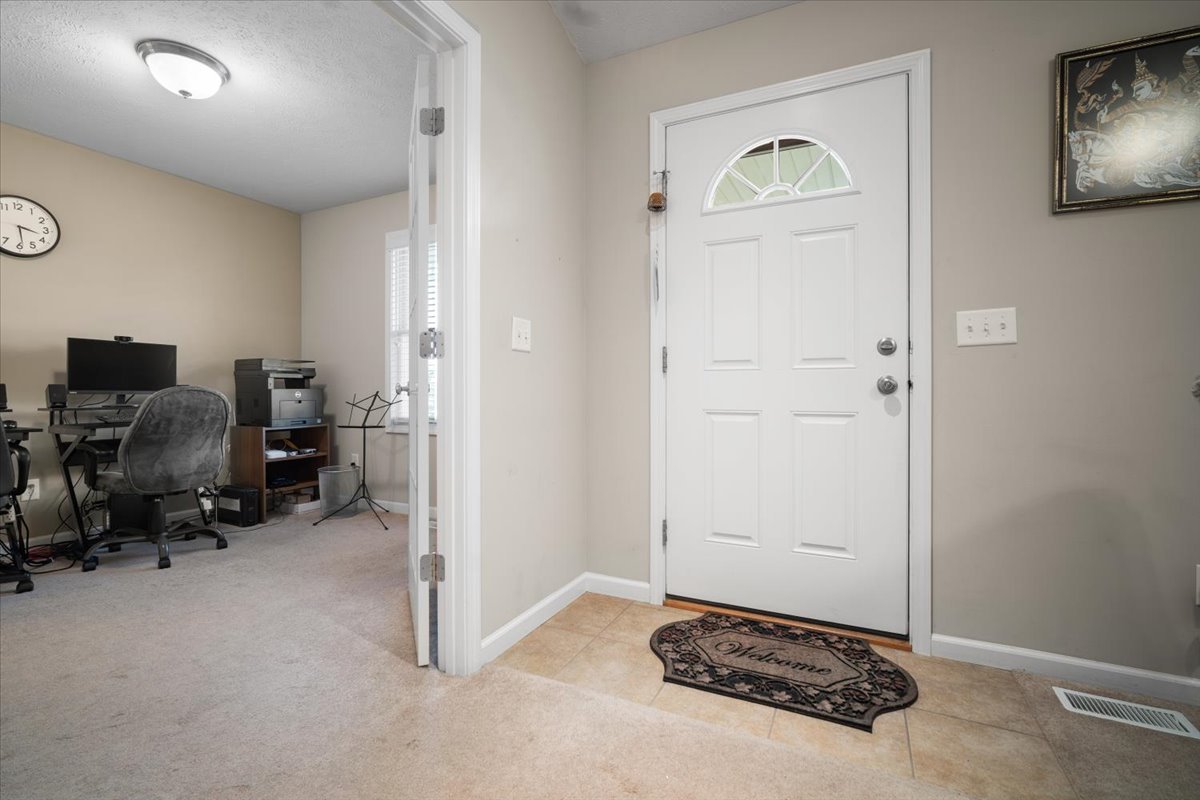 1600 Belclare Road Normal, IL 61761 - Photo 29 of 40 a view of livingroom with workspace and a window
