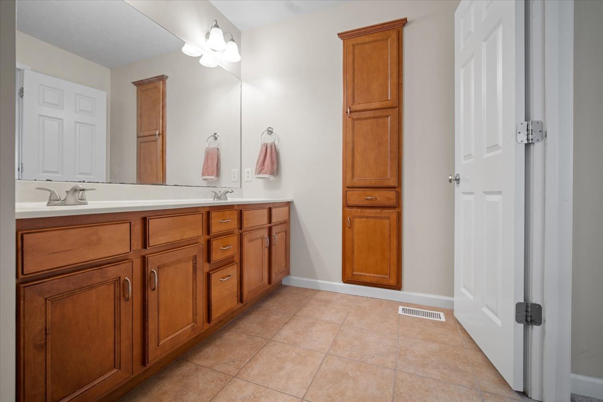 1600 Belclare Road Normal, IL 61761 - Photo 5 of 40 a bathroom with a double vanity sink and a mirror