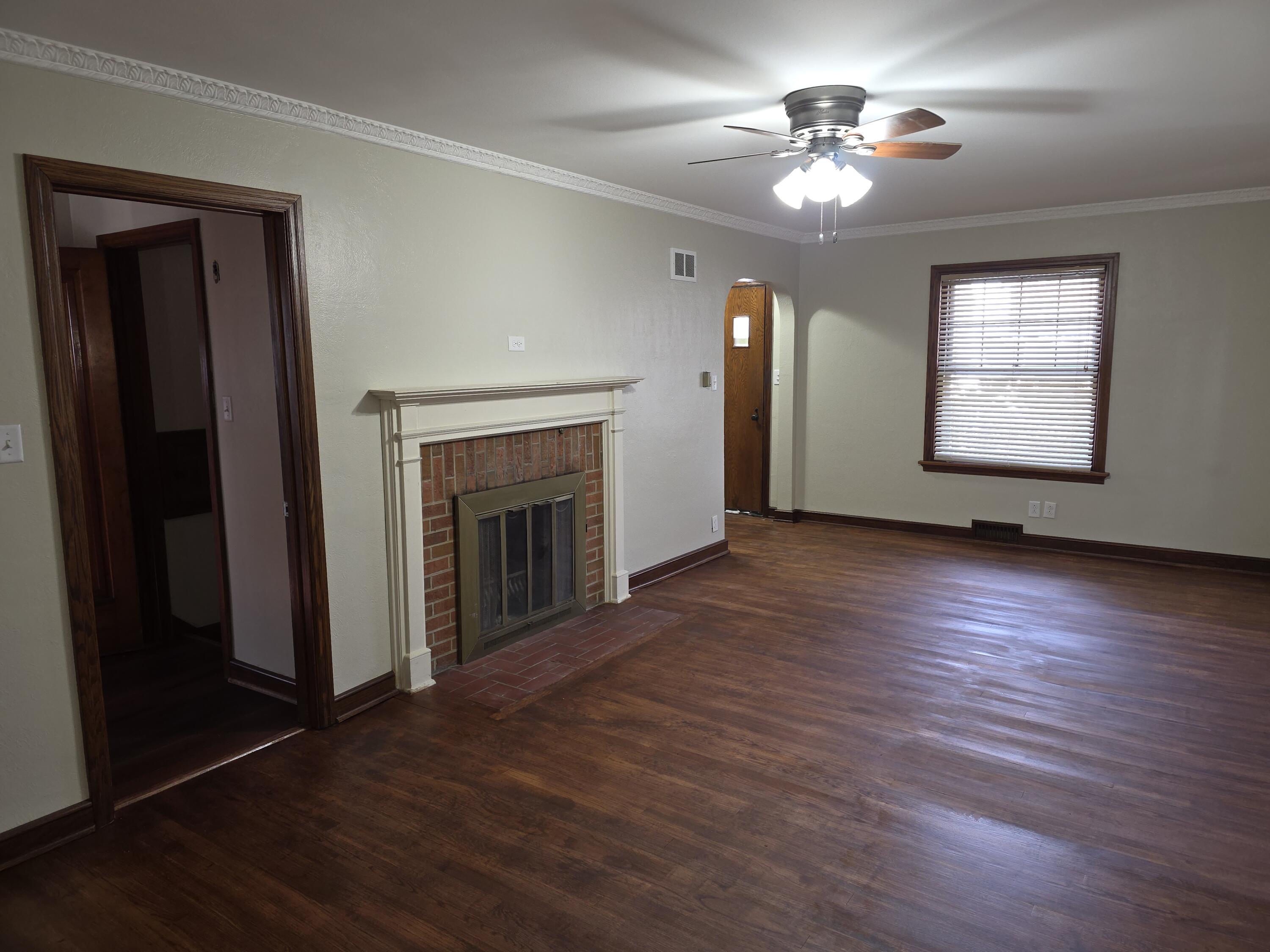 3530 North 55th Street Milwaukee, WI 53216 - Photo 3 of 26 Living room area with wood burning fire place