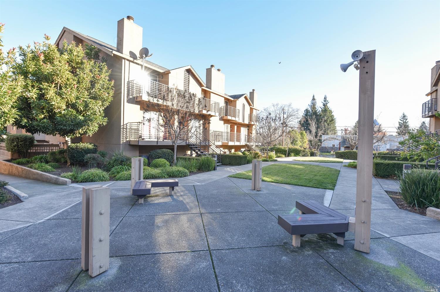 a view of a patio with a table and chairs