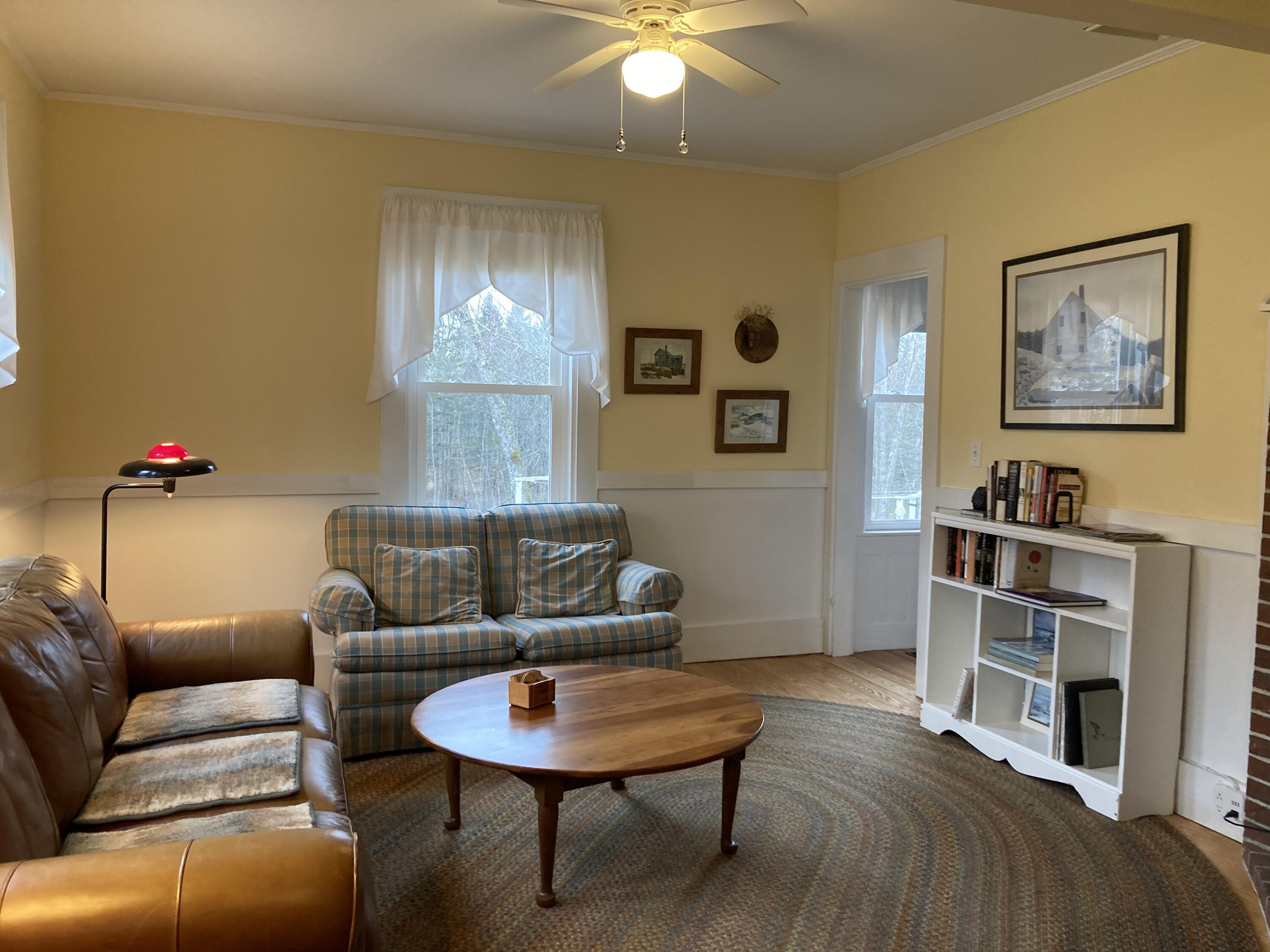 455 Point Road Hancock, ME 04640 - Photo 12 of 30 Living room with built-in bookcase.