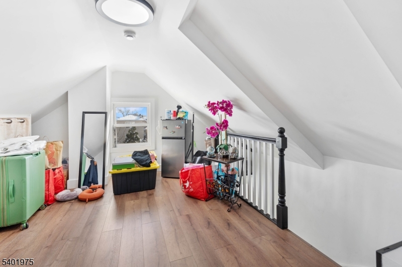 123 Jaques Street Elizabeth, NJ 07201 - Photo 13 of 20 a bedroom with furniture and a flat tv screen