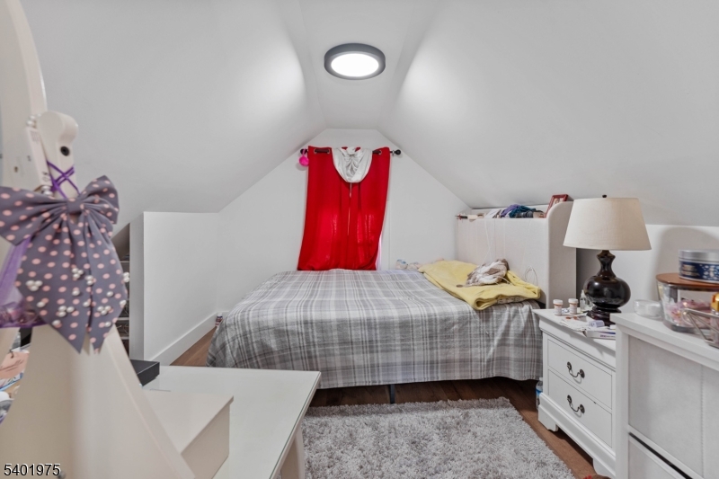 123 Jaques Street Elizabeth, NJ 07201 - Photo 14 of 20 a bedroom with a bed and window