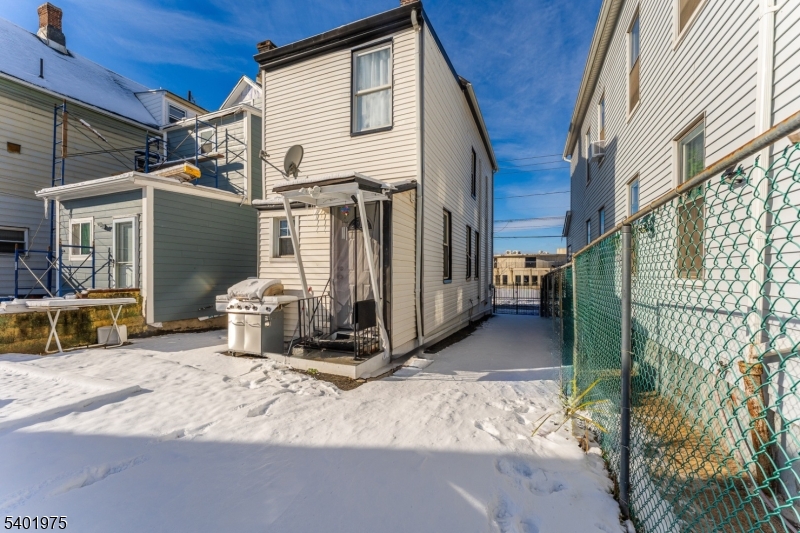 123 Jaques Street Elizabeth, NJ 07201 - Photo 16 of 20 a view of a house with a yard and garage