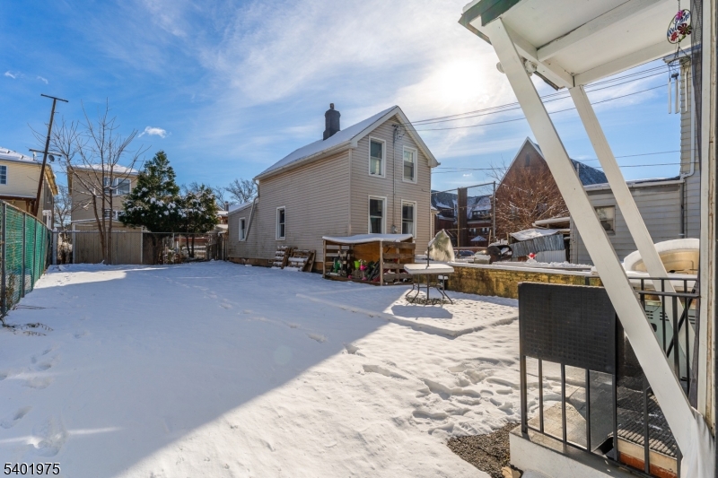 123 Jaques Street Elizabeth, NJ 07201 - Photo 20 of 20 a view of a house with wooden floor and roof