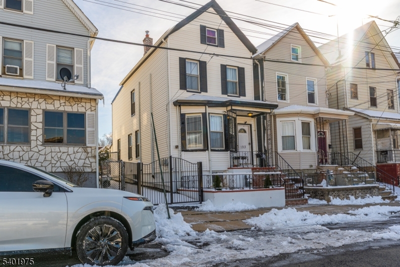 123 Jaques Street Elizabeth, NJ 07201 - Photo 3 of 20 a front view of a house with garden