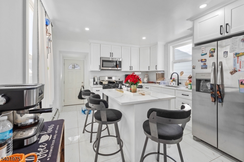 123 Jaques Street Elizabeth, NJ 07201 - Photo 6 of 20 a kitchen with stainless steel appliances kitchen island granite countertop a sink and cabinets