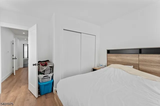 a bedroom with a bed and a walk in closet