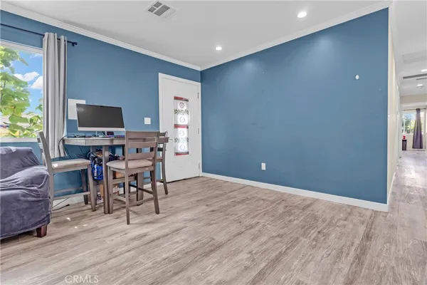 a view of a livingroom with furniture and a flat screen tv