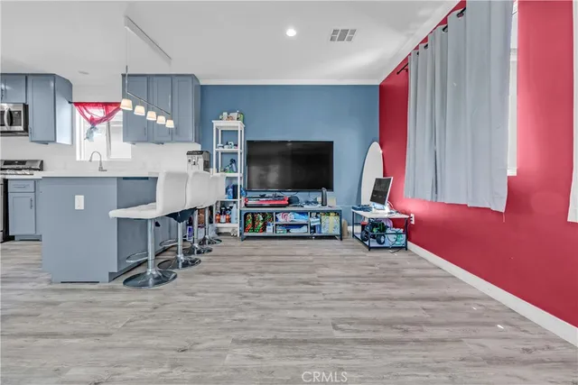 a view of a livingroom with furniture and a flat screen tv