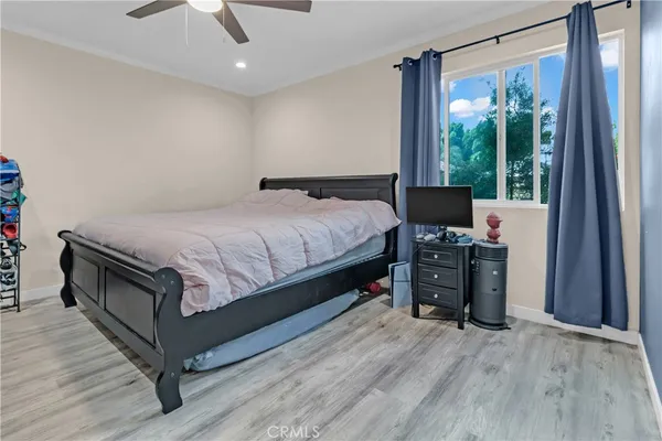 a bed room with a bed and a television