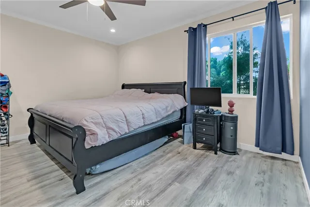 a bed room with a bed and a television