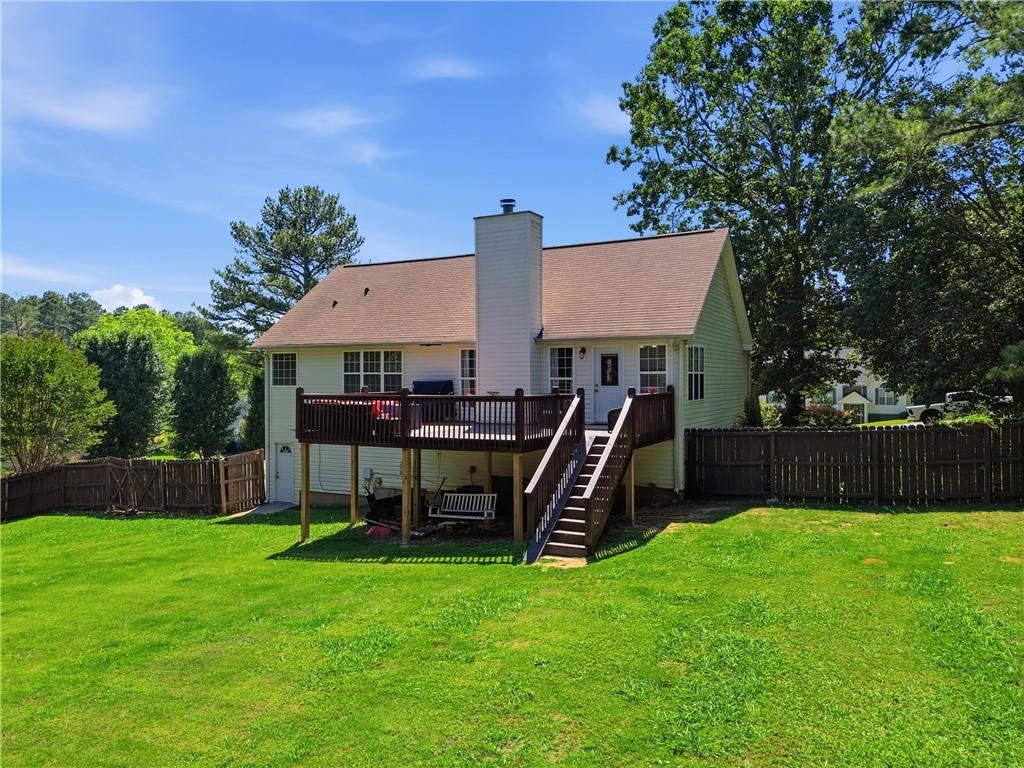 137 Orchard Way Southeast Calhoun, GA 30701 - Photo 5 of 39 a view of a house with a backyard and a patio