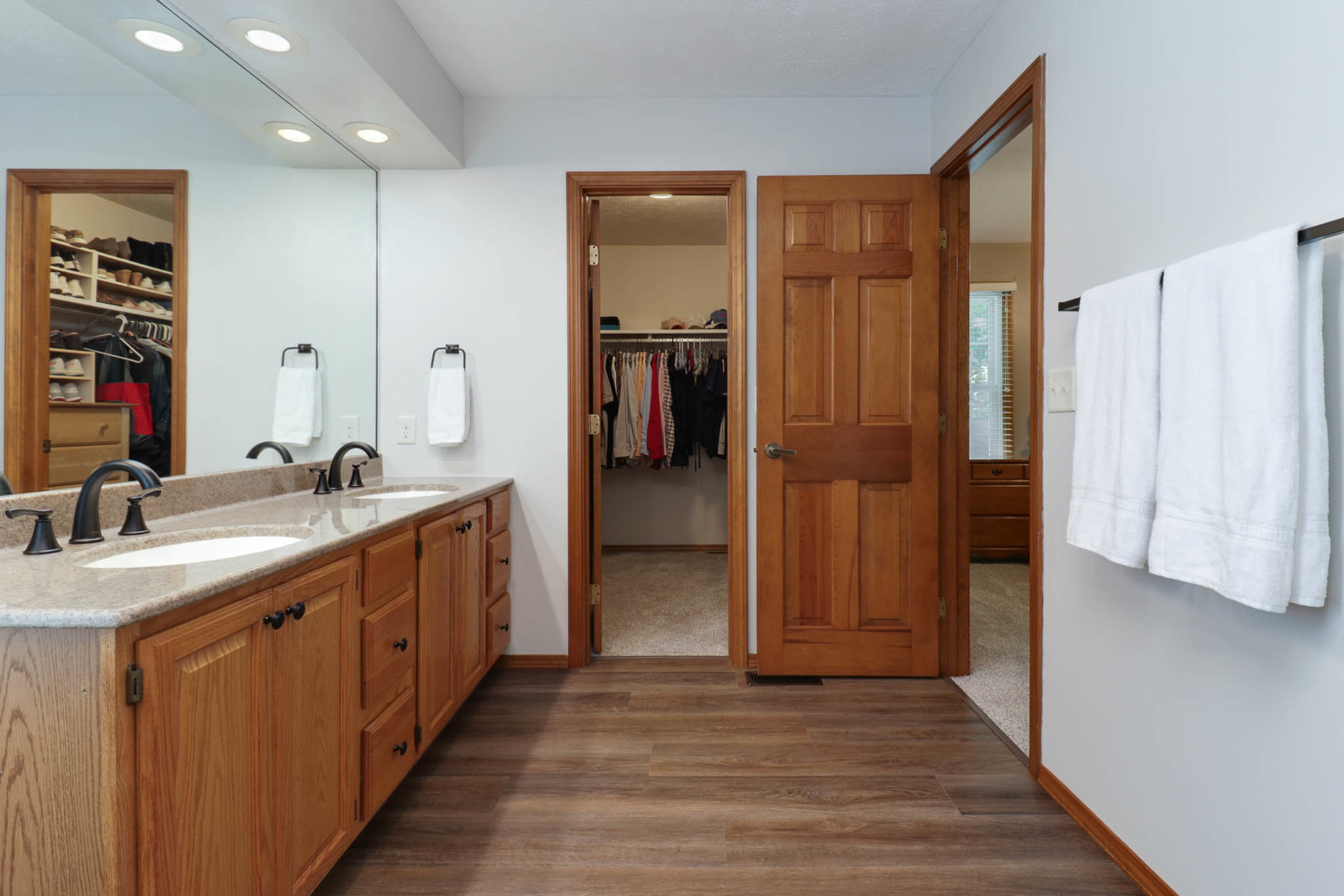 3203 Eagle Crest Road Bloomington, IL 61704 - Photo 23 of 52 a bathroom with a double vanity sink and a mirror