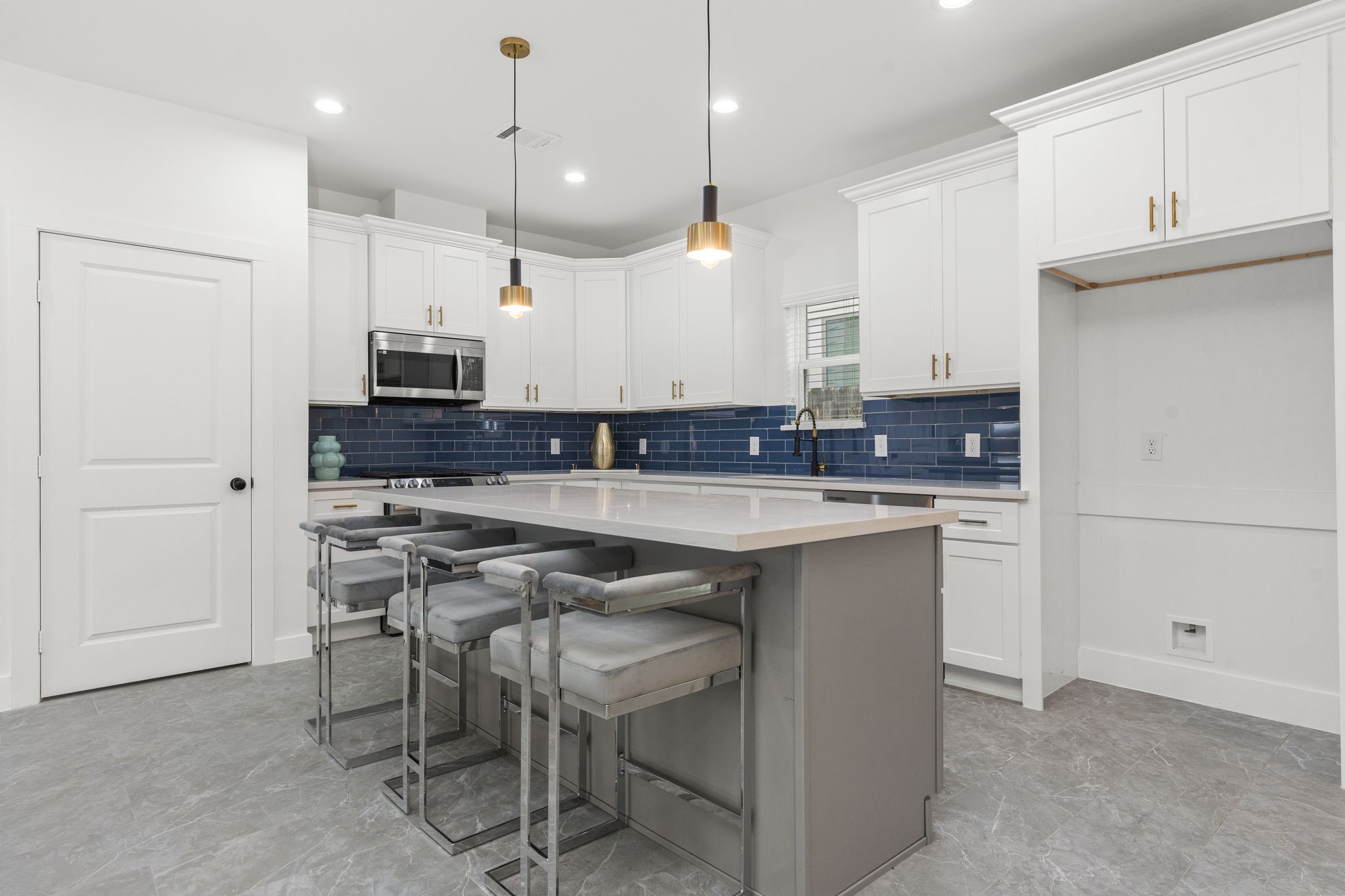 1517 Egypt Street Houston, TX 77009 - Photo 16 of 46 a kitchen with kitchen island granite countertop a sink a counter space appliances and cabinets