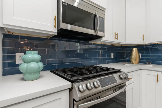 a kitchen with a stove and a microwave