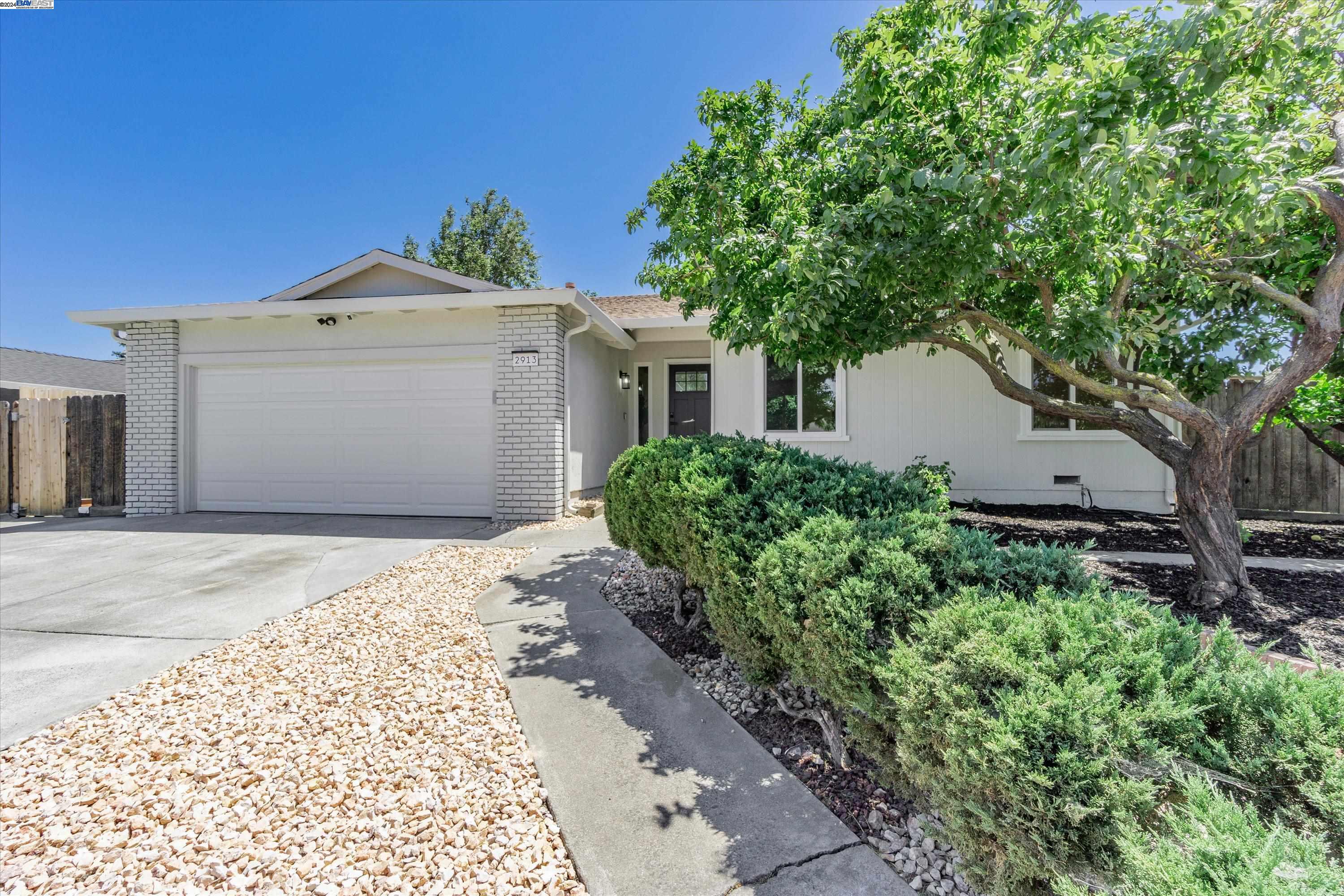 2913 Enea Way Antioch, CA 94509 - Photo 1 of 1 a front view of a house with a garden and trees