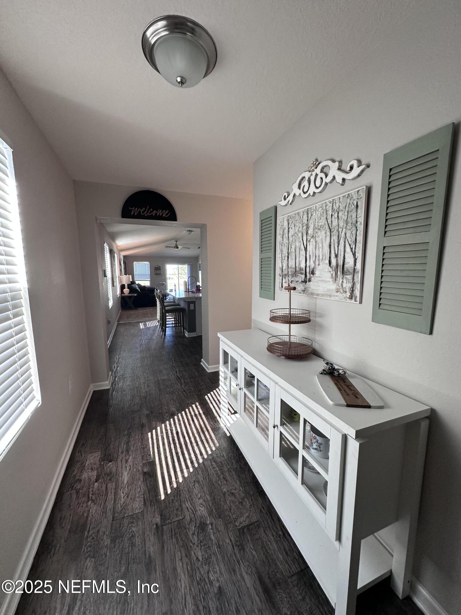 2535 Acorn Creek Road Green Cove Springs, FL 32043 - Photo 13 of 26 a kitchen with stainless steel appliances a stove a sink a chimney and a dining table