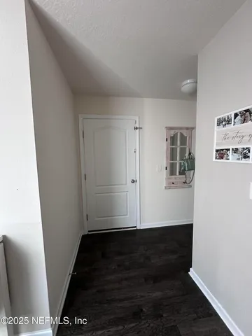 a spacious bedroom with a bed and a couch