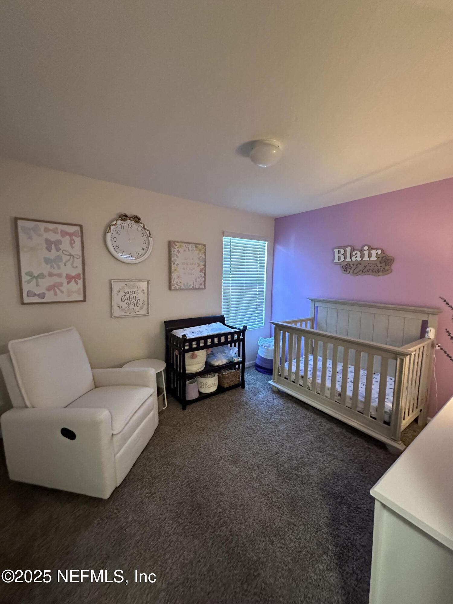2535 Acorn Creek Road Green Cove Springs, FL 32043 - Photo 15 of 26 a spacious bedroom with a bed and a couch