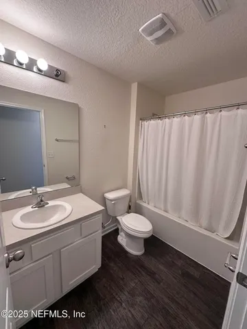 a en suite bathroom with a sink and a mirror
