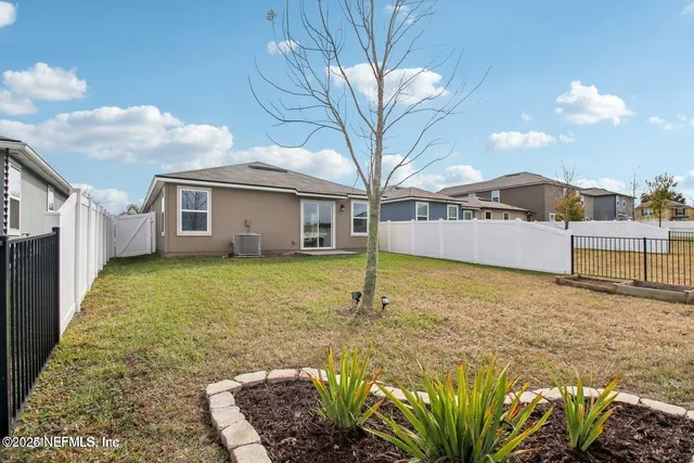 a large white house with a large pool in front of it
