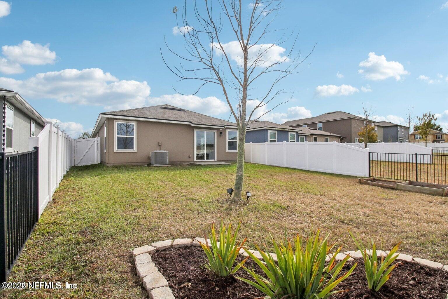 2535 Acorn Creek Road Green Cove Springs, FL 32043 - Photo 3 of 26 a large white house with a large pool in front of it