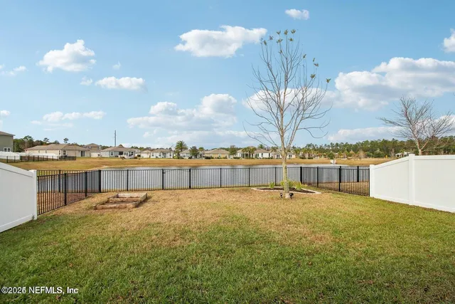 a view of a swimming pool and an outdoor space